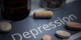 Bild på texten "Depression" och piller.